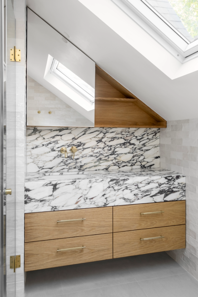 designer bathroom with stone countertop calacatta viola