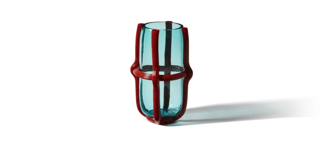 Green Sestiere Murano glass vase by Patricia Urquiola for Cassina on console table.