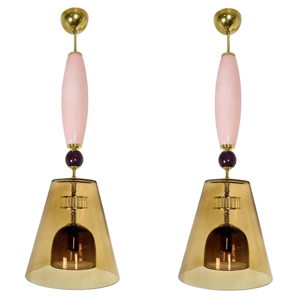 Pair of brown pink Murano glass pendant lights hanging in modern interior.